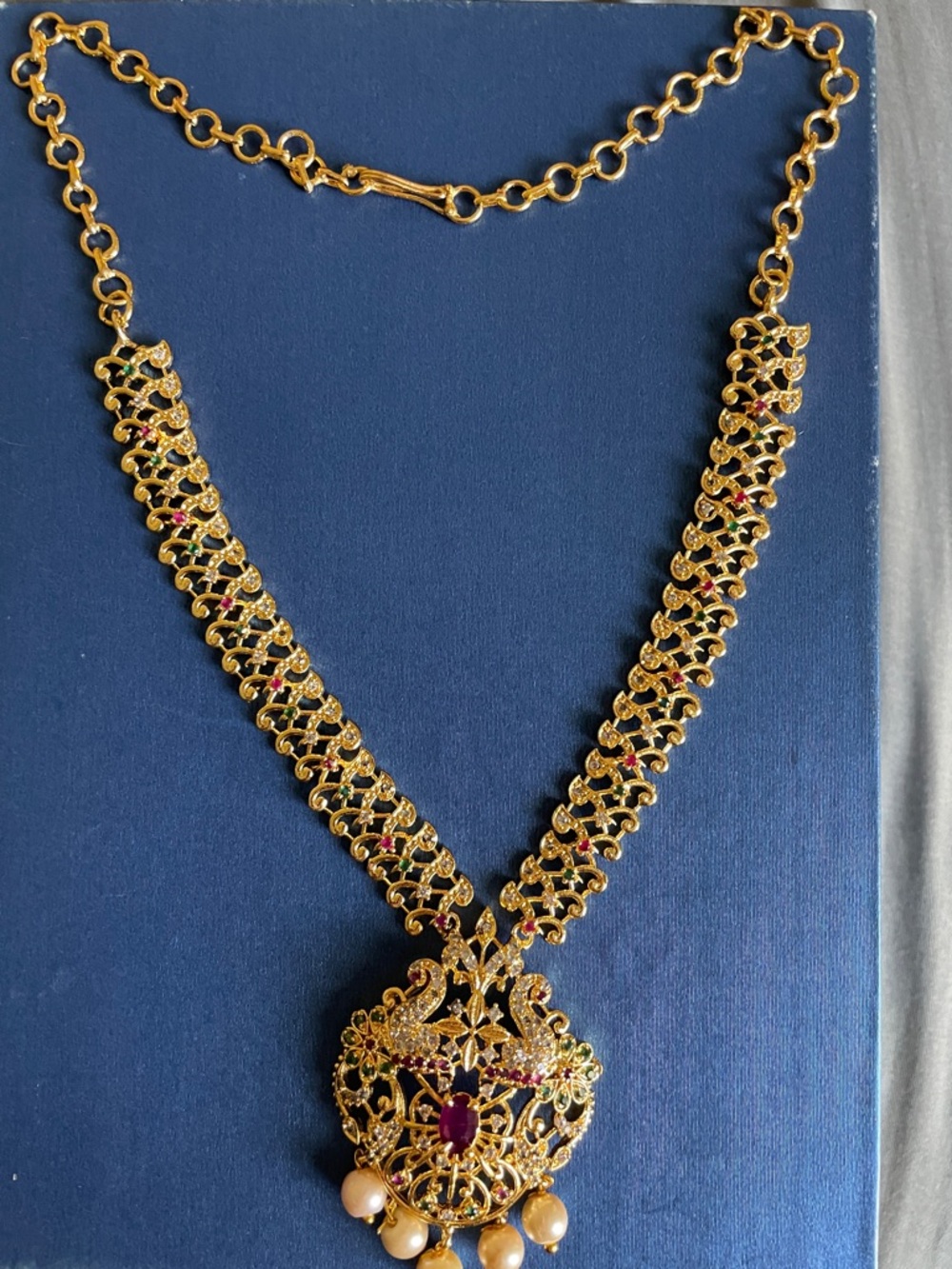 Gold-Tone Floral Filigree Pendant Necklace with Red and Green Accents